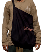 a man wearing a t - shirt and a black tote bag