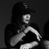 a black and white photo of two women sitting at a table