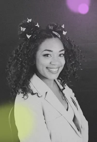 a black and white photo of a woman with curly hair
