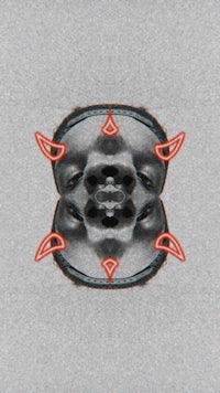 a black and white image of a man's face