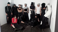 a group of people posing for a photo in a room