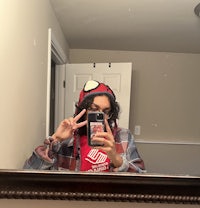 a woman taking a selfie in a mirror