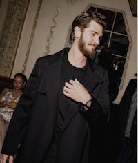 liam hemsworth at a party in london