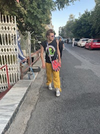 a woman is walking down a street