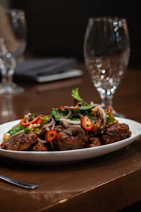 a plate of food on a wooden table