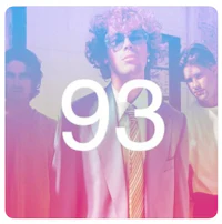 a group of men standing in front of a colorful background with the number 93