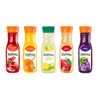 four bottles of fruit juice are lined up on a black background
