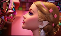 a barbie doll is kissing another barbie doll