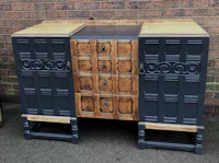 a black and wood sideboard with drawers