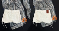 a pair of white shorts and a pair of scissors