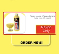 a bottle of rapaya juice on a yellow background