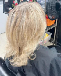 the back of a woman's hair in a salon