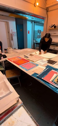 a group of people working in an art studio