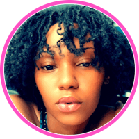 a black woman with curly hair in a pink circle