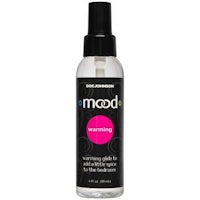 a bottle of moods warming spray on a white background