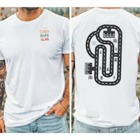 a man wearing a white t - shirt with a race track on it