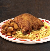 a plate with spaghetti and chicken on it