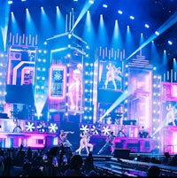 a group of people on stage at a concert