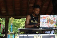 a man is using a laptop at a festival
