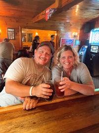 a man and a woman sitting at a bar