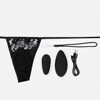 a black lingerie set with a remote control