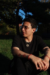 a man sitting on the grass