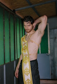 a man wearing a sash