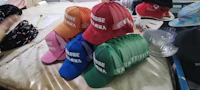 hats are sitting on a table in a factory