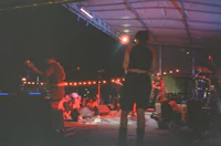 a group of people on stage at a concert
