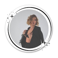 an image of a woman in a black top and blazer