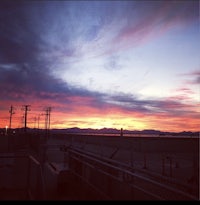 a colorful sunset over a parking lot
