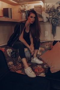 a woman sitting on a couch