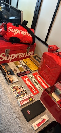 a red supreme box is sitting on a table