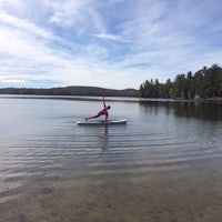 a person on a surfboard in the middle of a body of water