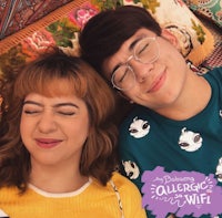 a man and woman laying on a couch