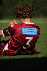 a soccer player laying on the ground