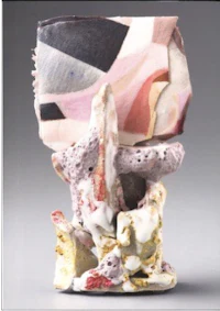 a ceramic vase with a pink and white pattern on it