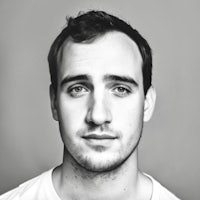 a black and white photo of a young man