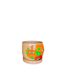 an orange and green planter with a face on it