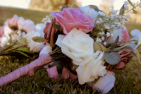 a bouquet of flowers laying on the grass