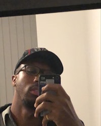 a man taking a selfie in a mirror