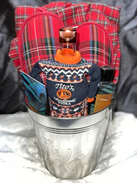 a bucket with a sweater and a bottle of wine
