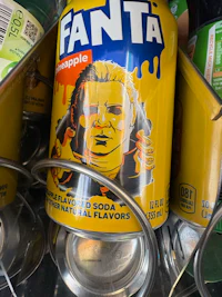 a can of fanta is sitting on a shelf