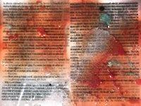 an open book with red and orange paint on it