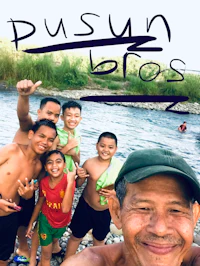 a group of people are posing for a photo in front of a river
