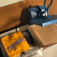 a machine with a t - shirt on top of it