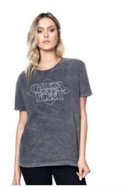 a woman is wearing a gray t - shirt with the word ghost town'' on it