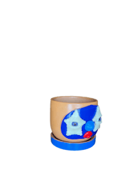 a blue cup with a blue face on it