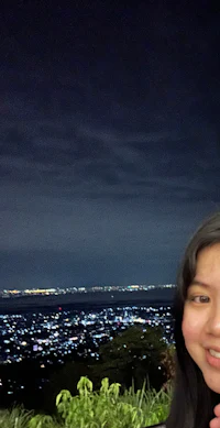 a woman posing for a photo at night