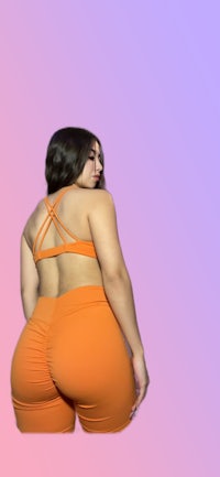 the back view of a woman in an orange bikini